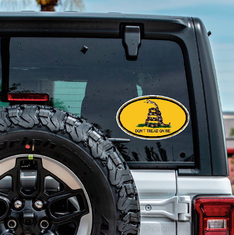 Back of a vehicle with a 'Don't Tread on Me' decal on the window.
