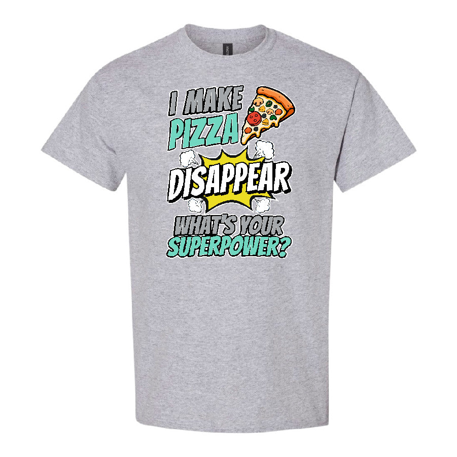 A heather gray short-sleeve crewneck t-shirt featuring a colorful graphic print on the front. The graphic includes a slice of pizza, comic-style text reading 'I MAKE PIZZA DISAPPEAR WHAT'S YOUR SUPERPOWER?', and a yellow comic burst.