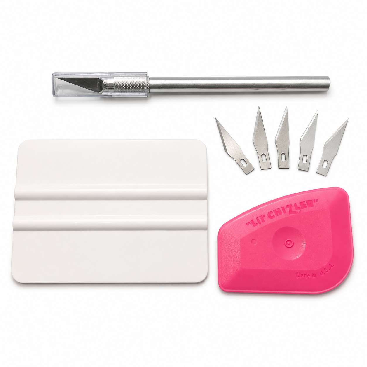 A vinyl graphics tool kit with a number 11 hobby knife tool, five stainless steel blades, a white plastic squeegee, and a bright pink plastic scraper on a white background.