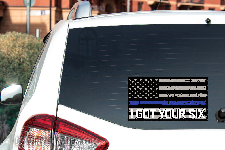 Car window with a decal featuring an American flag and &#39;I got your six&#39; text.